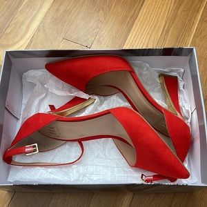 JLO red heels with gold accent